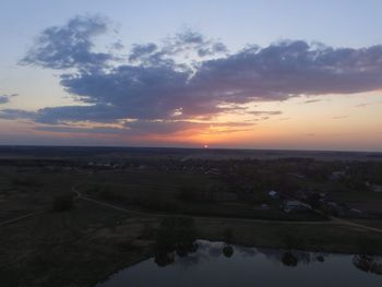 High angle view of field against sky during sunset