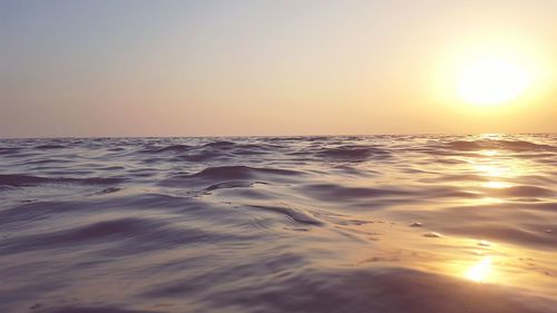 Scenic view of sea against clear sky during sunset