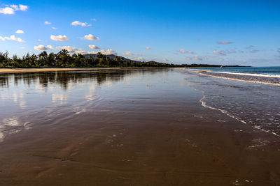 Scenic view of beach against sky during sunset