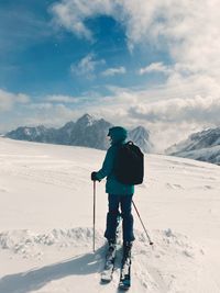 Man skiing on snow covered mountain