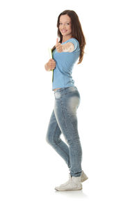 Portrait of smiling young woman against white background