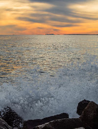 Scenic view of sea against sky during sunset