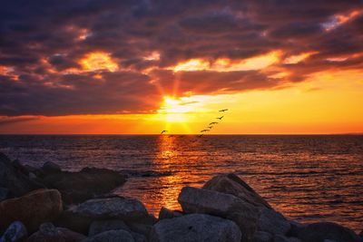 Scenic view of sea against sky during sunset