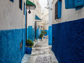 Narrow alley amidst buildings in town