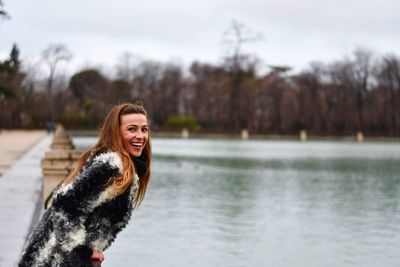 Portrait of smiling young woman in winter