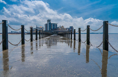 Pier over sea against sky