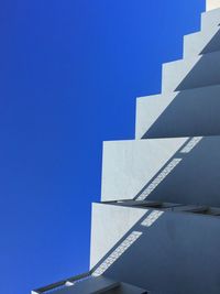 Low angle view of building against clear blue sky