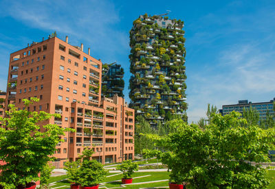 Buildings in city against sky