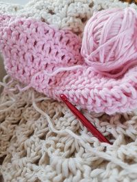 Ball of wool with knitting needle on crochet