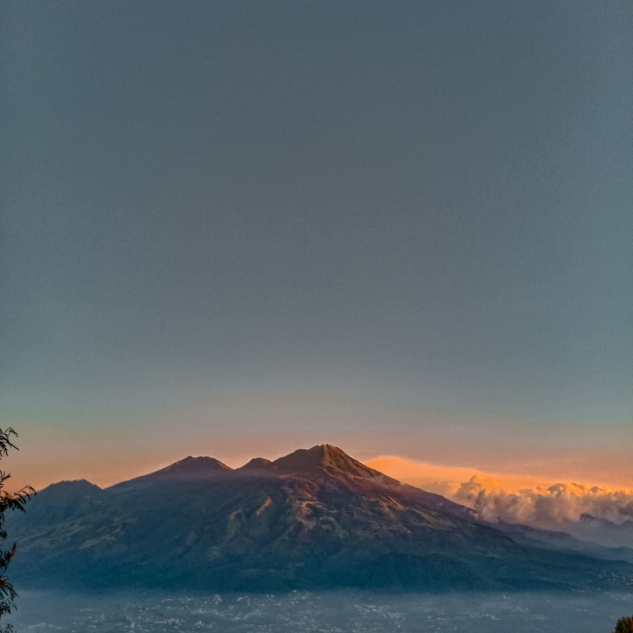 SCENIC VIEW OF MOUNTAINS AGAINST SKY DURING SUNSET