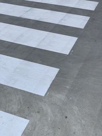 High angle view of arrow sign on floor