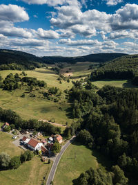 High angle view of trees and buildings against sky