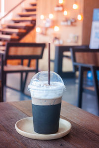 Close-up of drink served on table at cafe