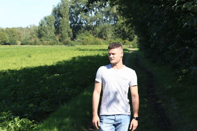 Young man standing on field