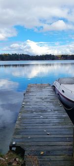 Pier over lake against sky