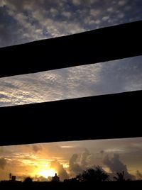 Low angle view of silhouette trees against sky during sunset