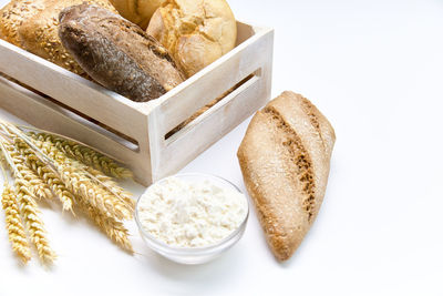 Delicious breads next to the spikes on a white background.