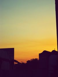 Silhouette of built structure at sunset