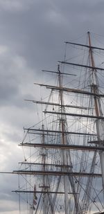 Low angle view of sailboat on sea against sky