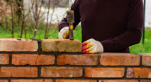 Man working on wall