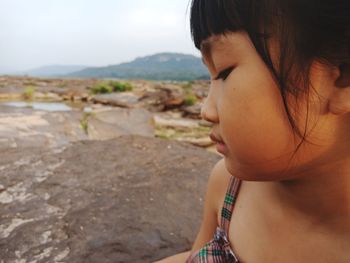 Close-up portrait of woman looking away