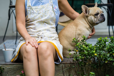 Midsection of woman with dog