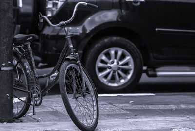 Bicycle parked on street in city