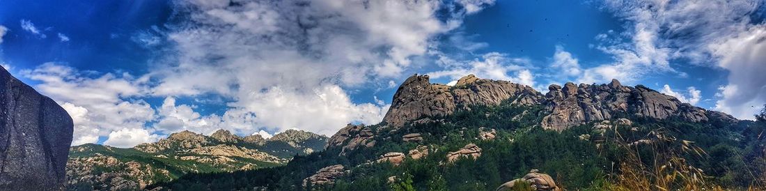 Low angle view of panoramic shot of mountain range against sky