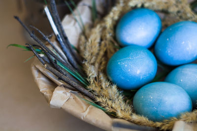 High angle view of multi colored eggs on table