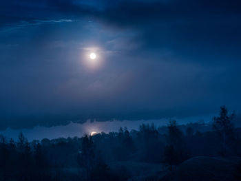 Scenic view of landscape against sky at night