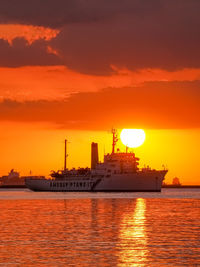 View of sea against orange sky