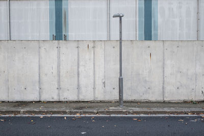 View of street against wall