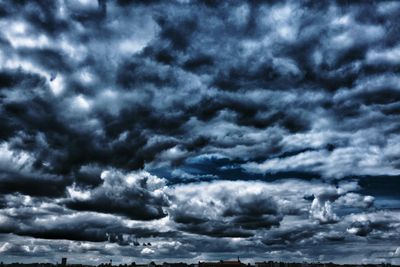 Storm clouds over cloudy sky