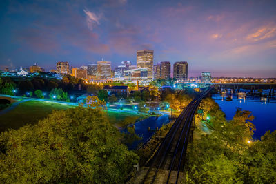 High angle view of illuminated buildings in city against sky