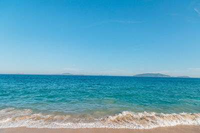 Scenic view of sea against clear blue sky