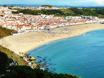 High angle view of townscape by sea