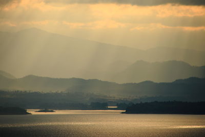 Scenic view of lake against sky during sunset