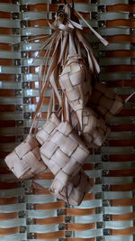 Close-up of clothes hanging on table against wall