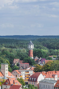 Houses in town against sky