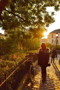 Full length of woman walking on footpath