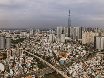 High angle view of modern buildings in city against sky