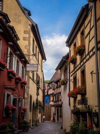 Narrow street amidst buildings in town