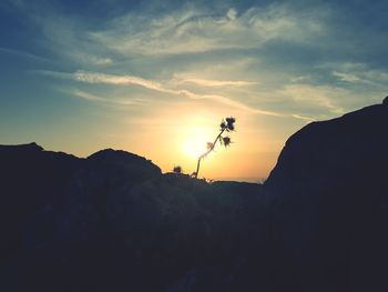 Scenic view of silhouette mountains against sky during sunset