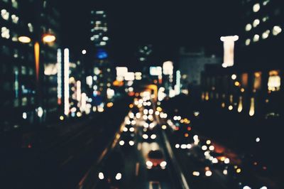 Defocused image of illuminated street at night