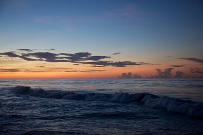 Scenic view of sea against sky at sunset