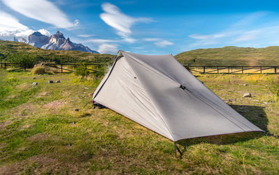 Tent on field against sky