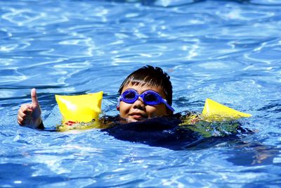 Boy swimming in pool