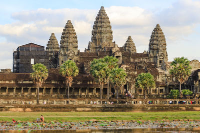 View of temple building against cloudy sky