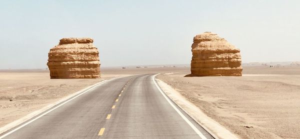 Empty road against clear sky