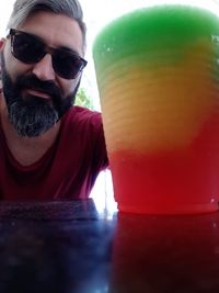 Portrait of young man with drink